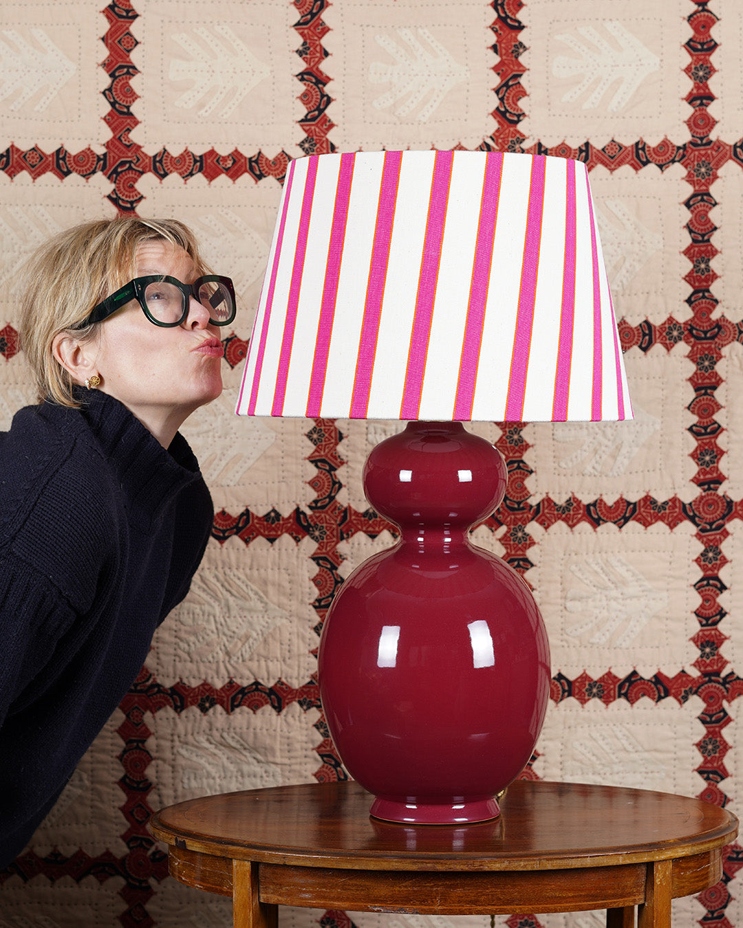 burgundy red ceramic lamp with pink striped lampshade