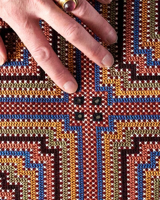 Kala Rama, Cross Stitches on Brick Red Cotton