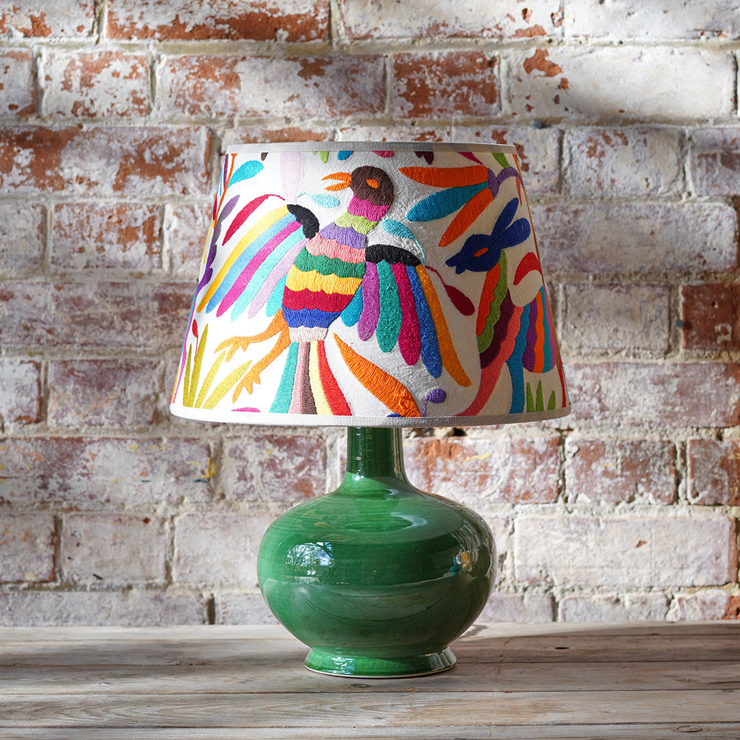 small green table lamp with multicoloured hand embroidered lampshade